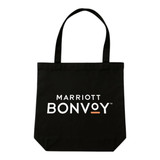 A black tote bag with two handles and a logo featured prominently on the front.