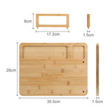 A bamboo cheese board with a knife set, featuring two cut-outs and a rectangular holder, measuring 35.5 cm by 28 cm.