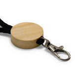 A round bamboo keytag with a black cord and a metal clip attachment.