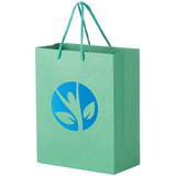 A green, extra-large laminated bag with a logo featuring a plant design and blue handles.