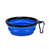 A collapsible pet bowl in blue with black accents and a carabiner for easy attachment.