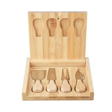 A bamboo cheese board set featuring a hinged lid and five cheese utensils. The wood has a natural finish.