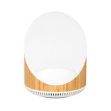 A wireless speaker and charger with a bamboo base and a sleek white top, featuring a minimalistic design.