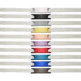 Classic shoelace charms displayed in various colours, featuring multiple charm designs and white shoelaces in the background.