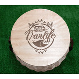 A circular wooden cooler basket lid featuring a "Vanlife" design with a camper van and wave illustration.