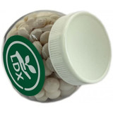 A clear plastic jar filled with white mints, featuring a white lid and a green logo.