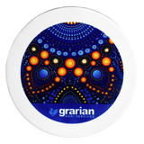 A circular ceramic coaster featuring a vibrant blue and orange design with dots, surrounded by a white border and a logo.