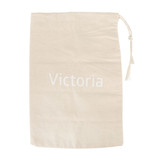 A large cotton produce bag in a light beige colour with a drawstring closure. It features a logo.