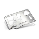 A silver multi-tool card with various tools and measurement markings, featuring a logo.