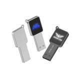 A silver and black square-shaped flash drive with a logo on one side and a smooth surface on the other.