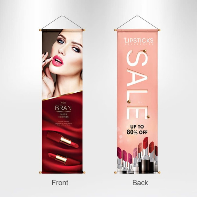 A hanging banner featuring a bold design with vibrant colours, showcasing a lipstick collection on one side and promotional text on the other.
