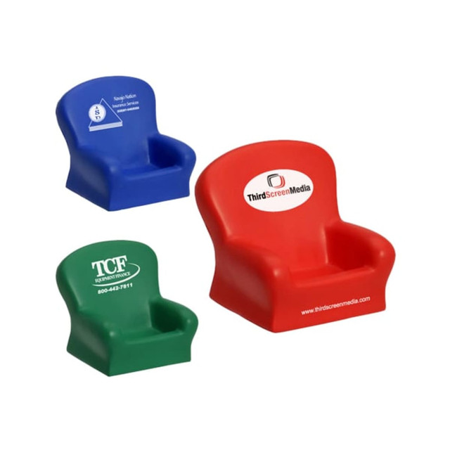 Three mini chair-shaped stress relievers in red, blue, and green with various logos on them.