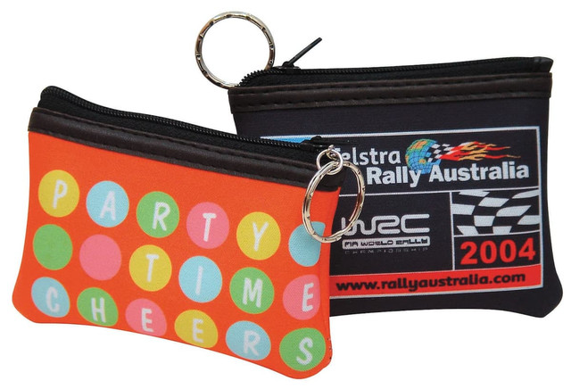 Two rectangular coin bags in bright orange and black, featuring a polka dot design and a logo. Each has a keyring attached.