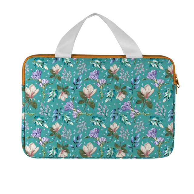 A laptop case featuring a floral design in shades of teal, purple, and green, with white handles.