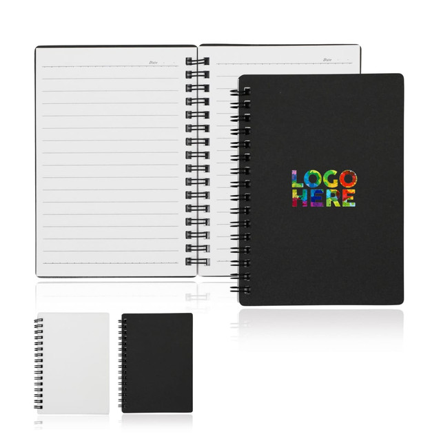 A spiral-bound A6 notebook with a black cover and colourful branding, featuring lined pages inside.