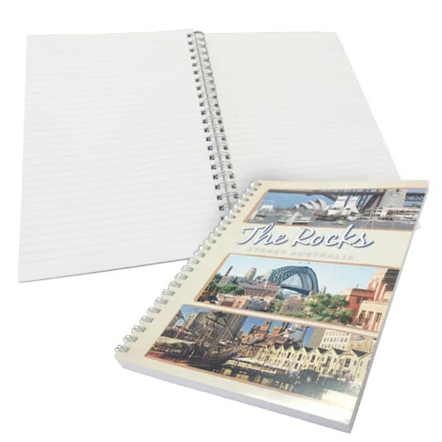 A soft cover wiro bound book with a multicoloured cover featuring urban images and blank lined pages.