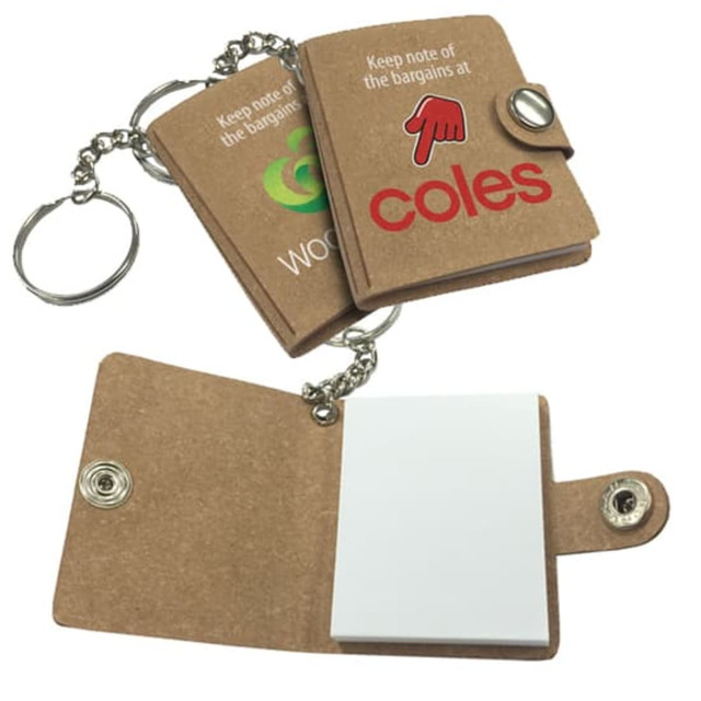 Bonded leather keychain book in brown with a chain, features a notepad and logos on the cover.