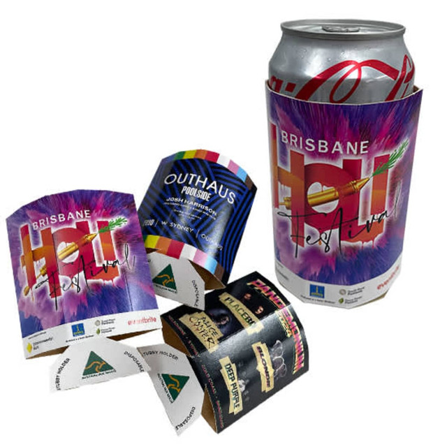 A drink bottle wrapped in a multicoloured disposable stubby holder featuring a logo and vibrant festival design.