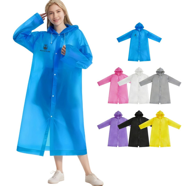 A woman in a blue raincoat, surrounded by various colours including pink, white, grey, purple, yellow, and black.