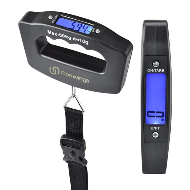 A black digital luggage scale with a handle and display, showing readings in kilograms and grams.