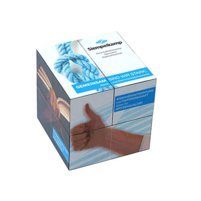 A clear promotional cube featuring various images and a logo, predominantly in blue and white colours.