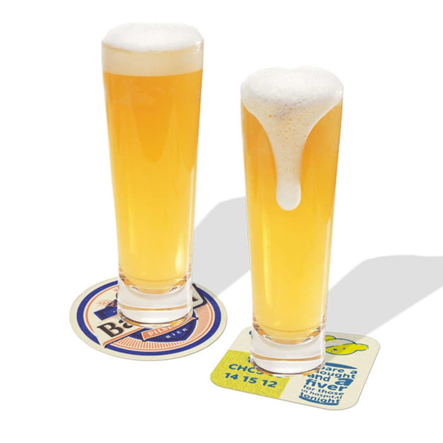 Beer coasters in various colours with two glasses of pale beer, one with a frothy head.
