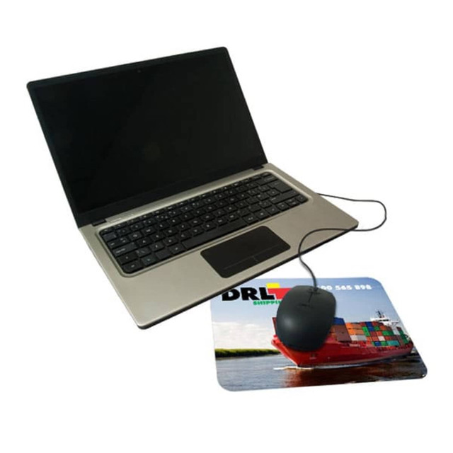 A sleek laptop next to a colourful microfiber mouse mat featuring a ship design and a mouse on top.