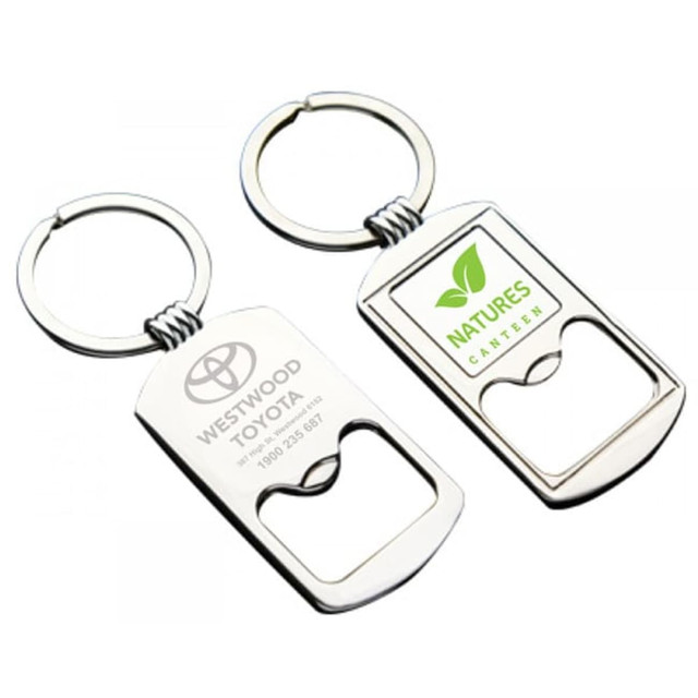 A silver metal keyring with a bottle opener feature, showcasing two sides, one with a logo and the other with text.