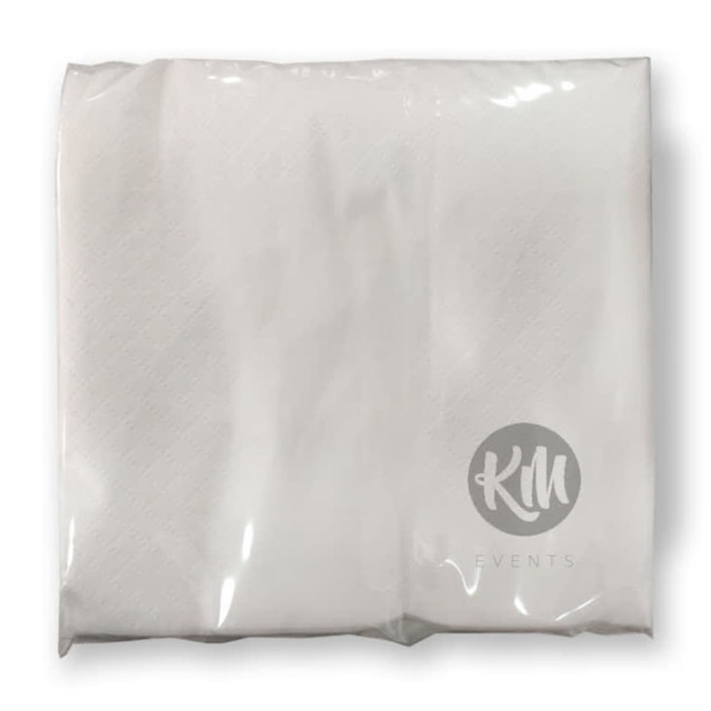 A pack of white paper napkins in clear packaging, featuring a logo on the front.