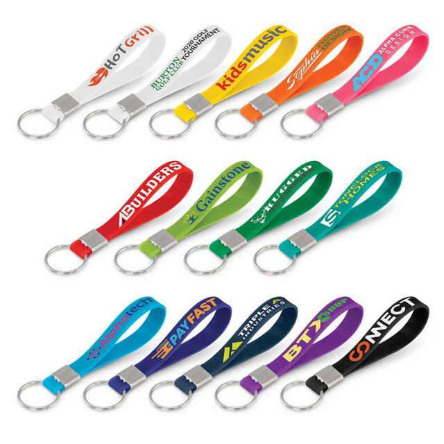 A selection of colourful silicone key rings with debossed branding, featuring various vibrant colours and a key ring attachment.