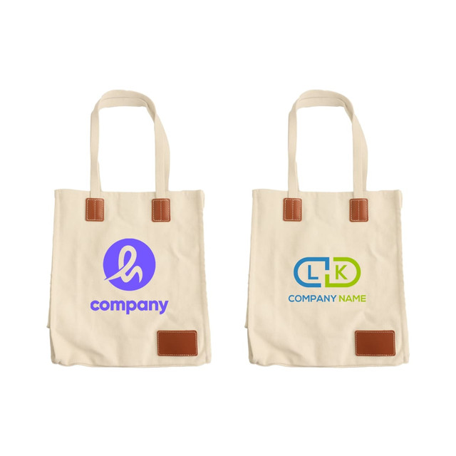 A canvas bag in beige with tan leather accents and two different logos on each side.