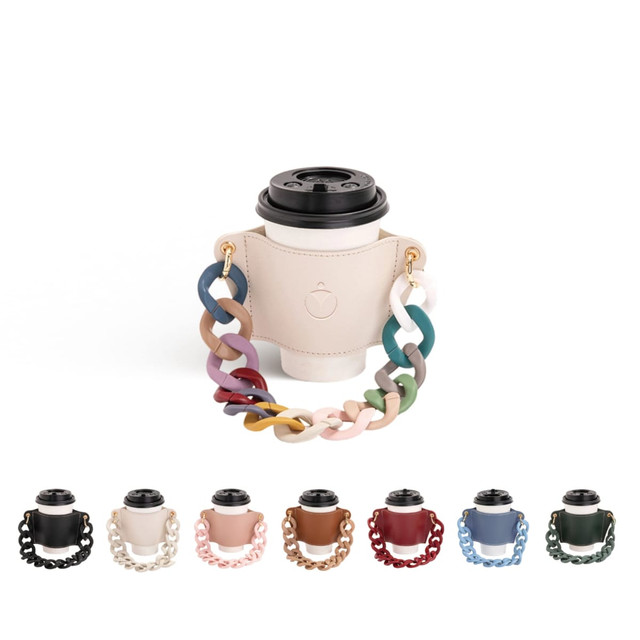 A drink bottle holder in a soft beige leather with a colourful acrylic strap, featuring a drink holder design.