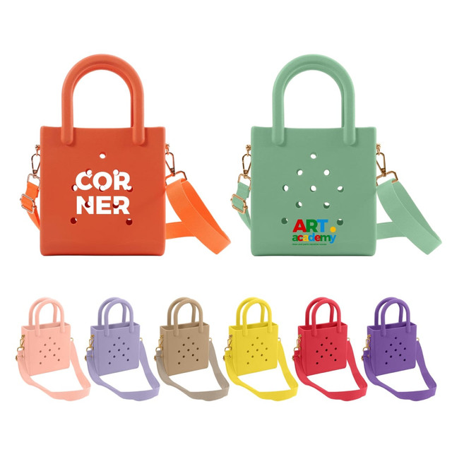 A mini beach bag in orange and green with holes, accompanied by several bags in pastel shades of pink, beige, yellow, and purple.
