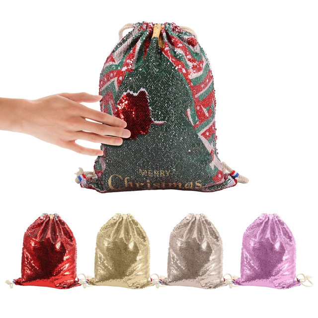 A drawstring bag covered in sequins features red and green colours, with a festive design. Includes a hand for scale.
