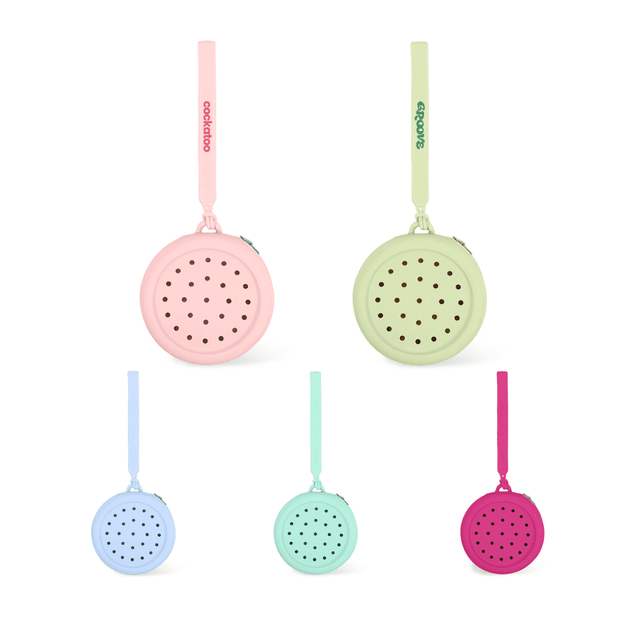 A round silicone pouch featuring holes, available in pastel pink, green, blue, and purple with a strap and a logo.
