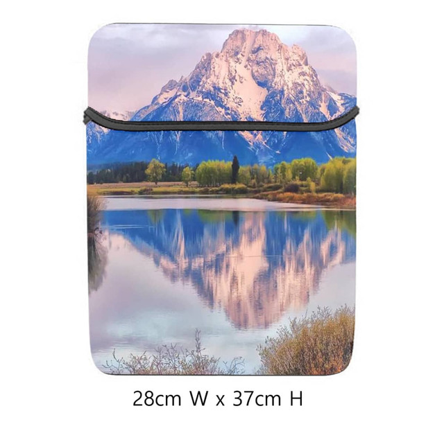 A 15-inch laptop sleeve featuring a scenic mountain and lake design with a black zipper and colourful landscape.