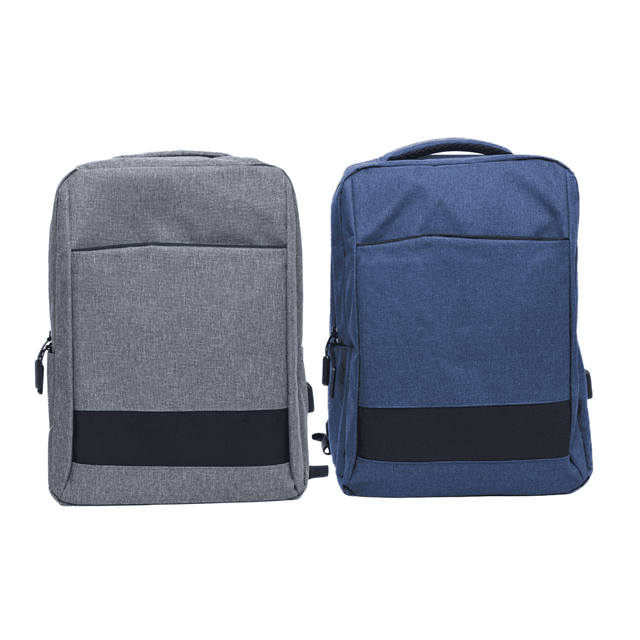 Two Slate Backpacks are displayed, one in grey and the other in navy blue, each featuring a front pocket and a top handle.