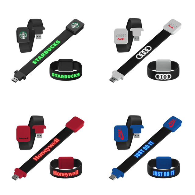 A set of USB flash drive bracelets in black, red, and grey, featuring various logos and brand names on different designs.