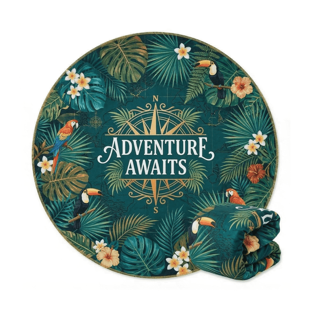 A round beach towel featuring a tropical design with green leaves, toucans, and flowers, folded beside it.