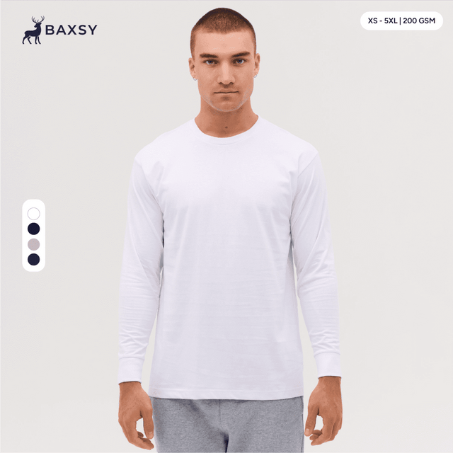 A long sleeve tee in white, featuring a relaxed fit and a logo on the upper left side.