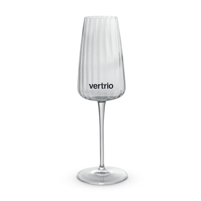 A clear glass flute featuring vertical ridges and a logo on the front, set on a slender stem.