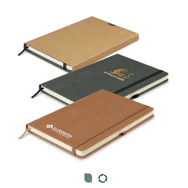 A set of three recycled hard cover notebooks in brown, green, and tan, featuring elastic bands and branding.