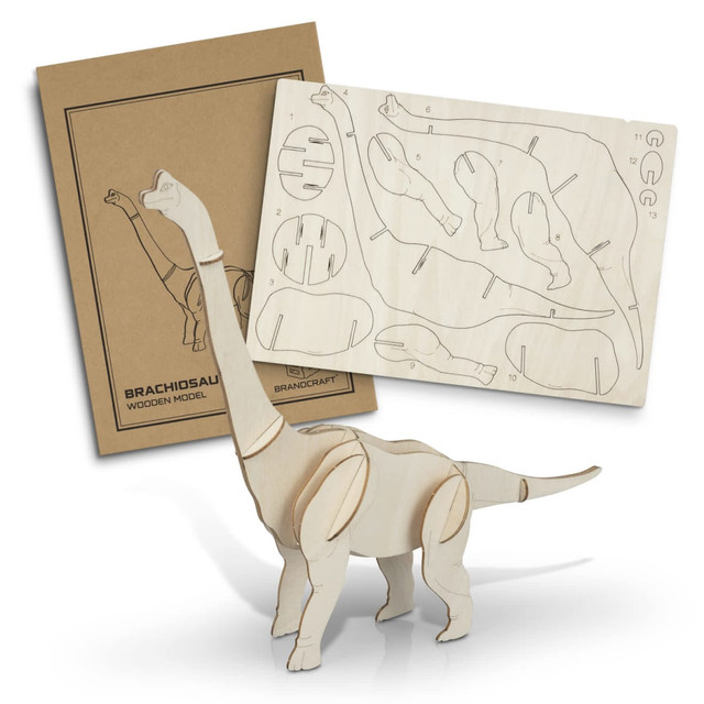 A Brachiosaurus wooden model in natural wood colour, alongside a sheet of pre-cut wooden pieces and packaging.