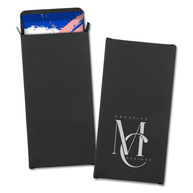 A small black box with a logo, containing a patterned chocolate bar inside.
