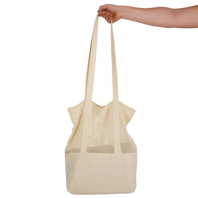 A hand holds a cream-coloured mesh tote bag with long straps, featuring a textured design.