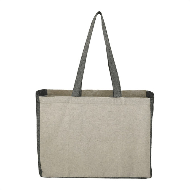 A recycled cotton tote bag in beige with grey contrast sides and long handles. Features an exterior pocket.
