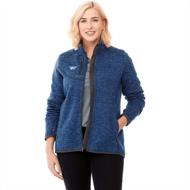 A women's knit jacket in blue with a zip-up front and a logo on the chest.