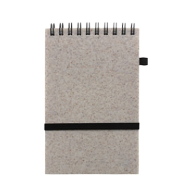 A6 notebook made from recycled wheat straw, featuring a black elastic band and a spiral binding.
