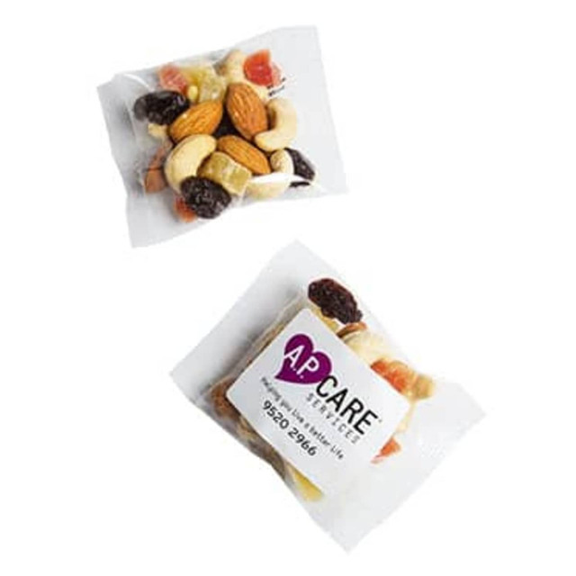 A clear package containing a fruit and nut mix with assorted nuts and dried fruits. The packaging features a logo.