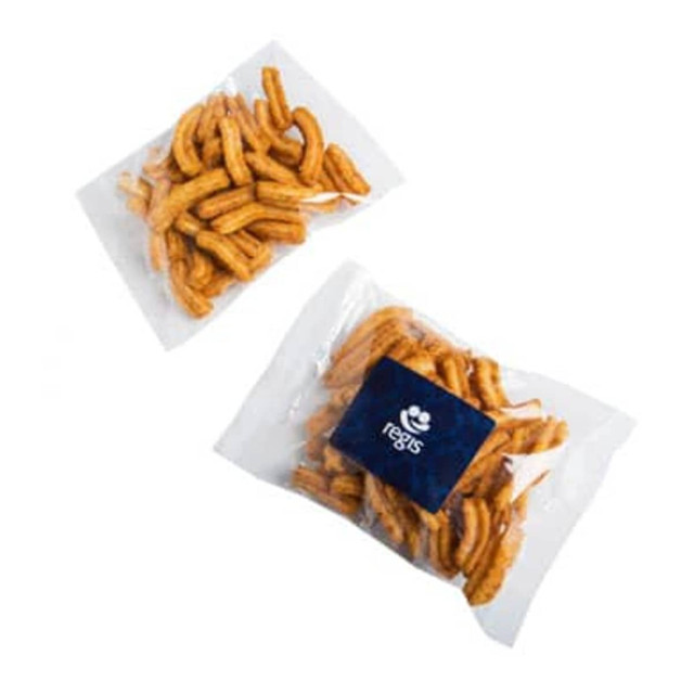 Soya crisps in transparent packaging, featuring light brown, crunchy snacks with a dark blue branded label.